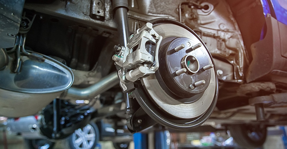 brake inspection of the car wheel at shallow depth of field | Cantrell Service Center