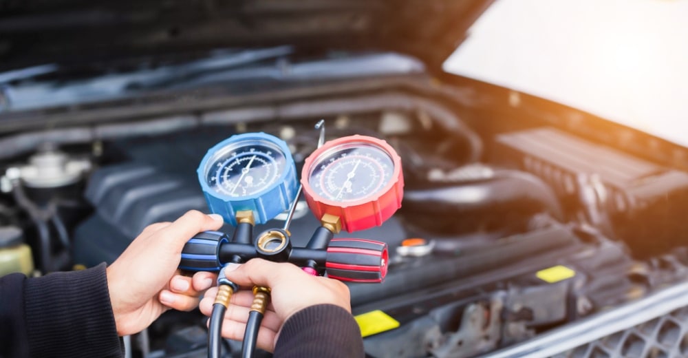 Car Air Conditioning Maintenance in Maumelle and North Little Rock, AR at Cantrell Service Center. Image of car air conditioner check service, leak detection, refrigerant refill, and system inspection by specialist technicians.