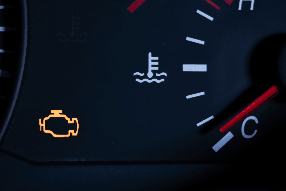 flashing check engine light, check engine light, North Little Rock, AR, Cantrell Service Center. Close-up of a car dashboard with a check engine light illuminated, indicating a potential issue requiring diagnostics.