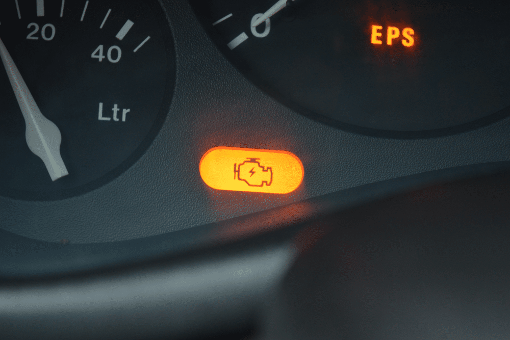 check engine light repair, auto repair in north little rock at Cantrell Service Center. Close-up of a lit check engine light on a vehicle dashboard.