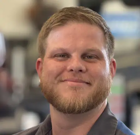 Photo of Drew, an ASE certified master technician.